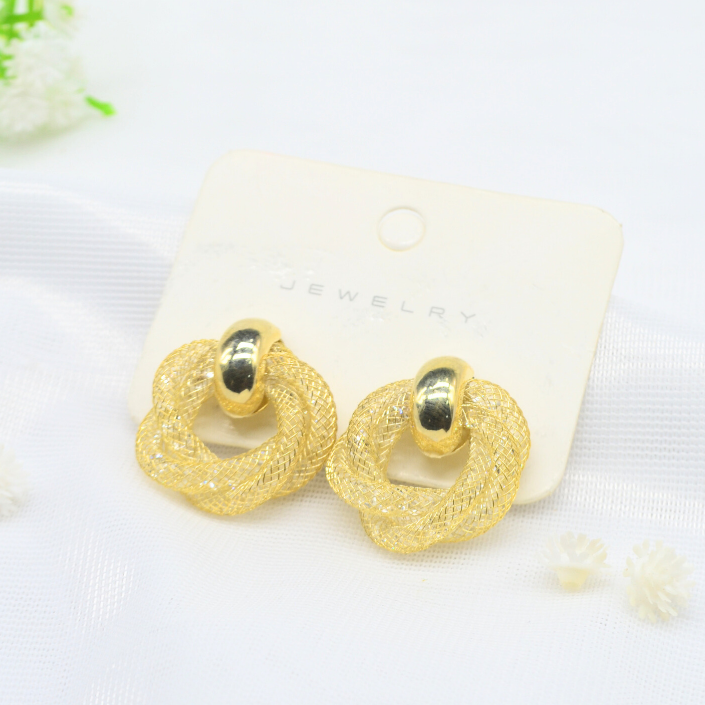 aretes nudo de seda